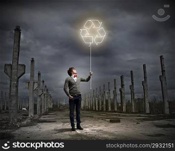 Young man with a recycle symbol