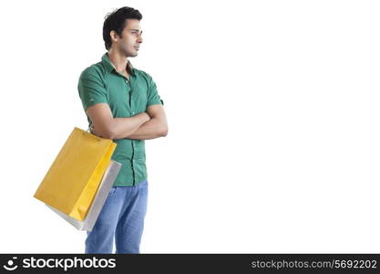 Young man with a shopping bag thinking