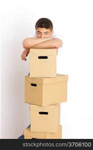 Young man with a stack of boxes