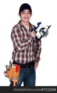 Young man with an electric saw