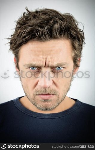 Young man with an evil expression