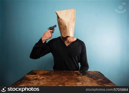 Young man with bag over head committing suicide