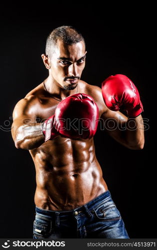 Young man with boxing gloves