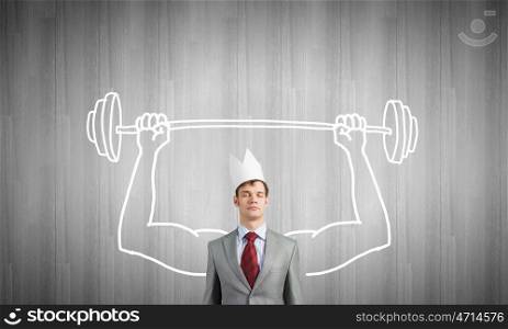 Young man with drawn strong hands lifting barbell. Strong and powerful