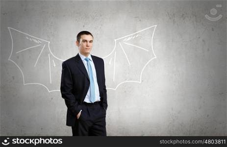 Young man with drawn wings behind back. Man with bat wings