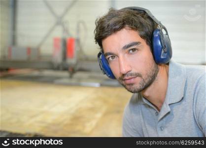 young man with earmuffs