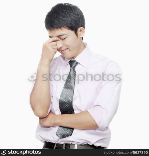 Young man with eyes closed thinking