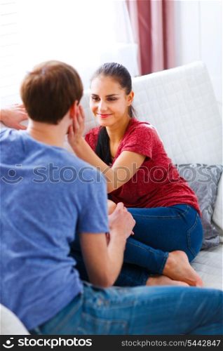 Young man with girlfriend relaxing at home&#xA;