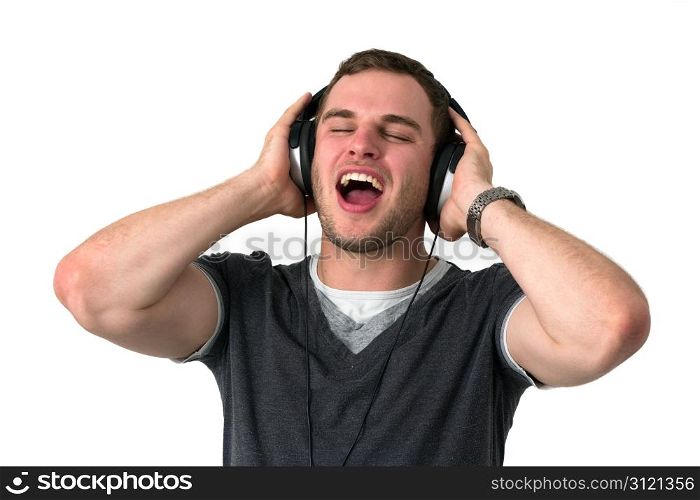 Young man with grey t-shirt Singing with headphones on head