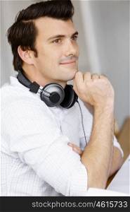 Young man with headphones. Portrait of young man with headphones