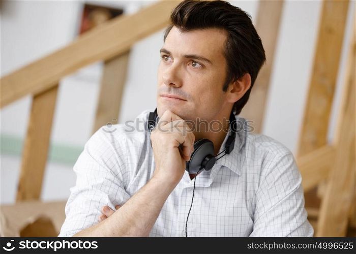 Young man with headphones. Portrait of young man with headphones