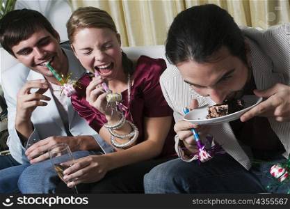Young man with his friends enjoying a birthday party
