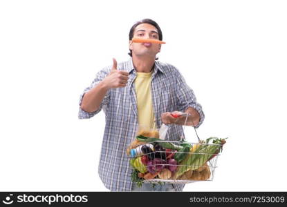 Young man with his grocery shopping on white