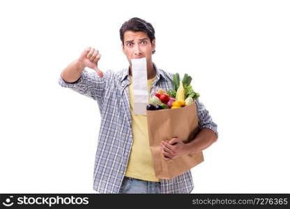 Young man with his grocery shopping on white