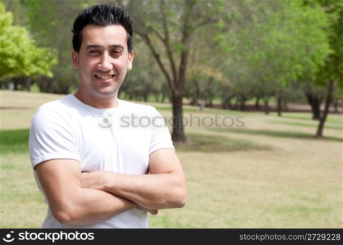 young man with his hands folded in the park,outdoor