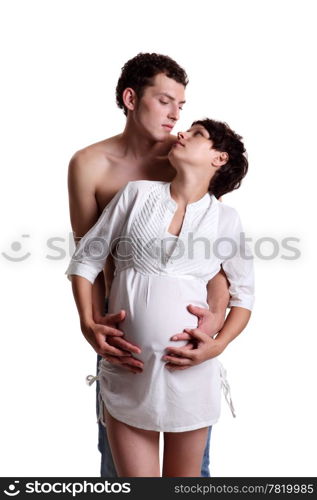 Young man with his pregnant wife on the white background