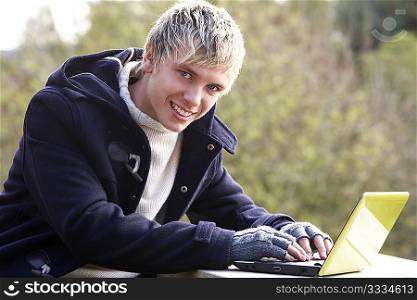 Young man with laptop computer