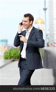 young man with mobile phone outdoors