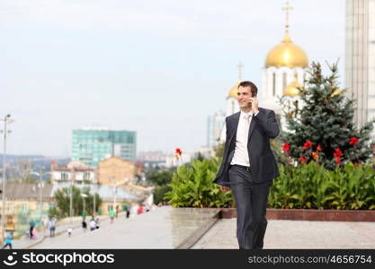 young man with mobile phone outdoors