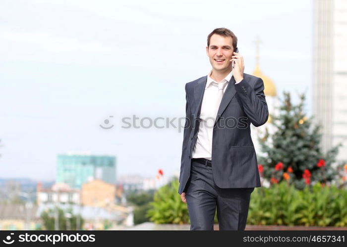 young man with mobile phone outdoors