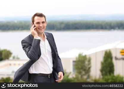 young man with mobile phone outdoors