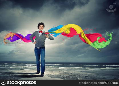 Young man with photo camera. Image of young man in red tie with photo camera taking pictures