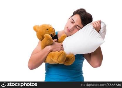 Young man with pillow isolated on white background