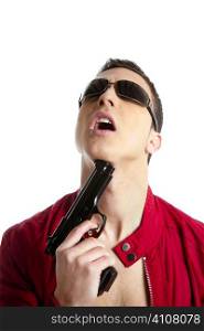 Young man with pistol gun pretending suicide, red jacket, white background