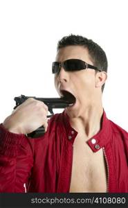 Young man with pistol gun pretending suicide, red jacket, white background