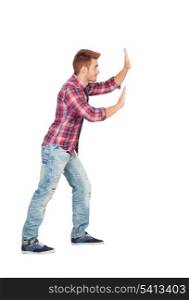 Young man with plaid shirt pushing isolated on white background