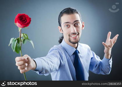 Young man with red rose