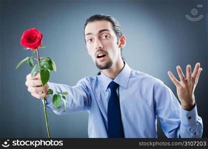 Young man with red rose