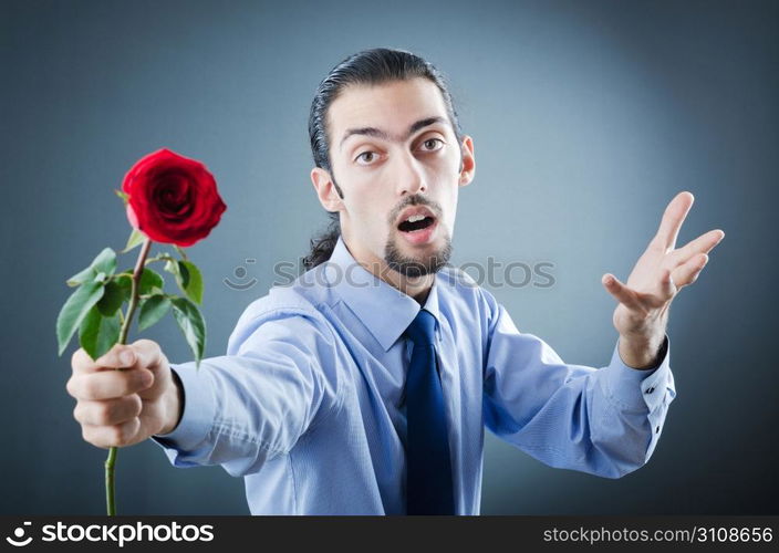 Young man with red rose