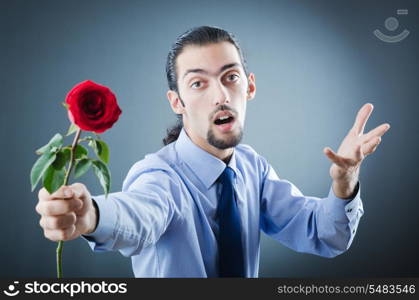 Young man with red rose