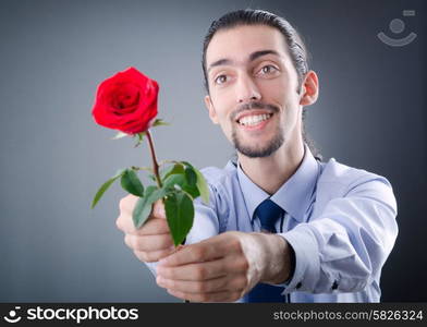 Young man with red rose