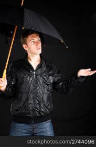 Young man with umbrella.
