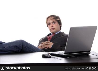 young man wondering while working with is laptop