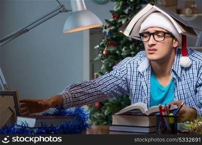 Young man working at home on christmas day