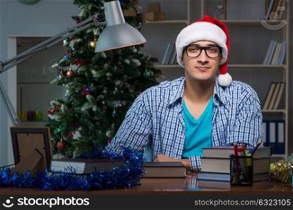 Young man working at home on christmas day