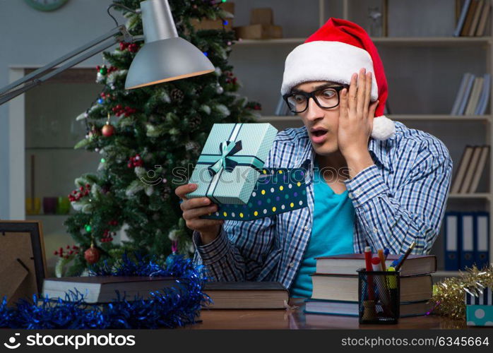 Young man working at home on christmas day