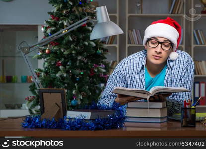 Young man working at home on christmas day