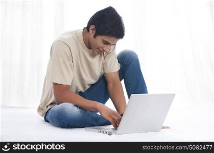 Young man working on laptop