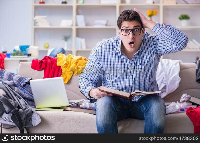 Young man working studying in messy room