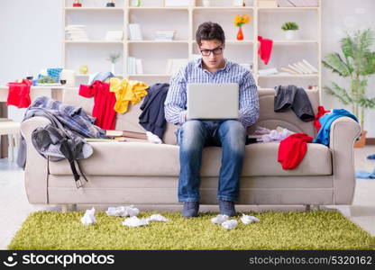 Young man working studying in messy room