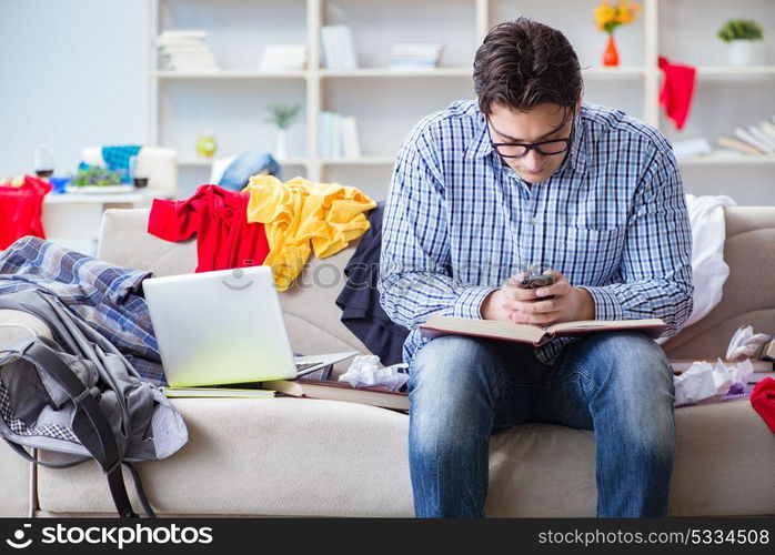 Young man working studying in messy room