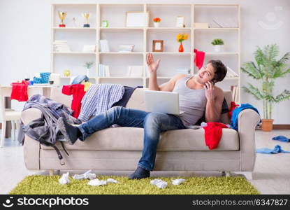 Young man working studying in messy room