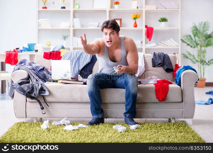 Young man working studying in messy room