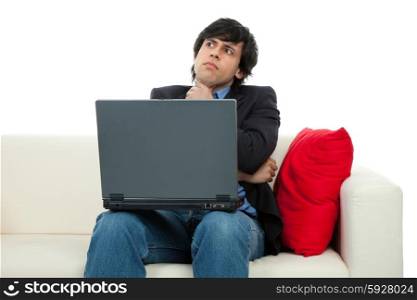 young man working with laptop in a couch