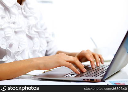 Young manager working with notebook in the office