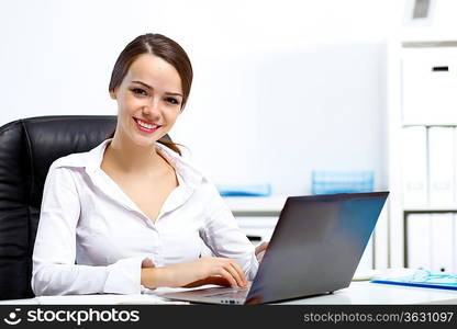 Young manager working with notebook in the office